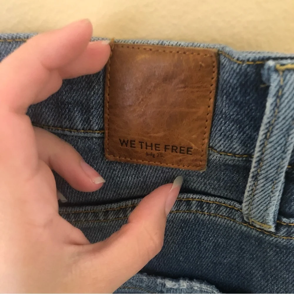 Free people we the free phoenix distressed blown out knees high rise jeans